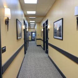 A hallway with Exam rooms and offices