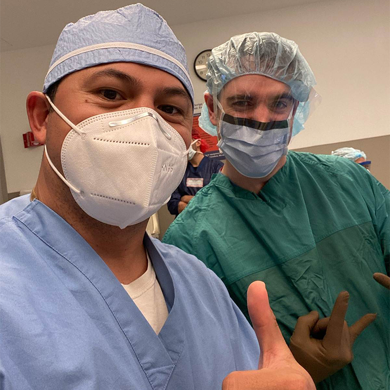 Doctor Boniello in surgical scrubs and mask