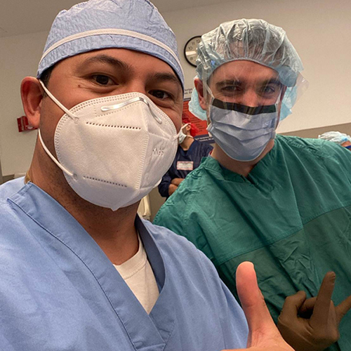 Doctor Boniello in surgical scrubs and mask